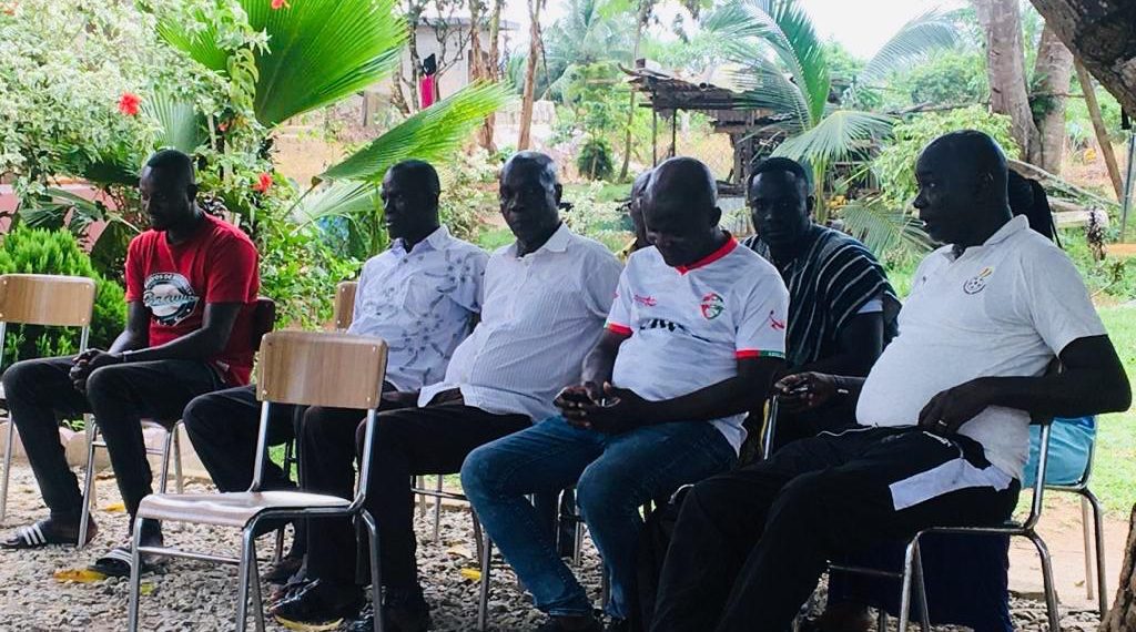 Medeama smoke peace pipe with aggrieved Karela Supporters