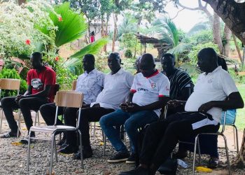 Medeama smoke peace pipe with aggrieved Karela Supporters