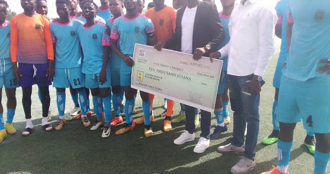 Hon. Simon Project presents GHC10,000 cheque to Basake Holy Stars